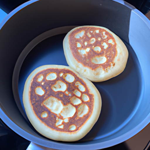 Fluffy pancakes cooked in a Dutch oven, perfect for a delicious breakfast.